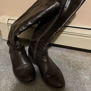 Tall dark brown boots.